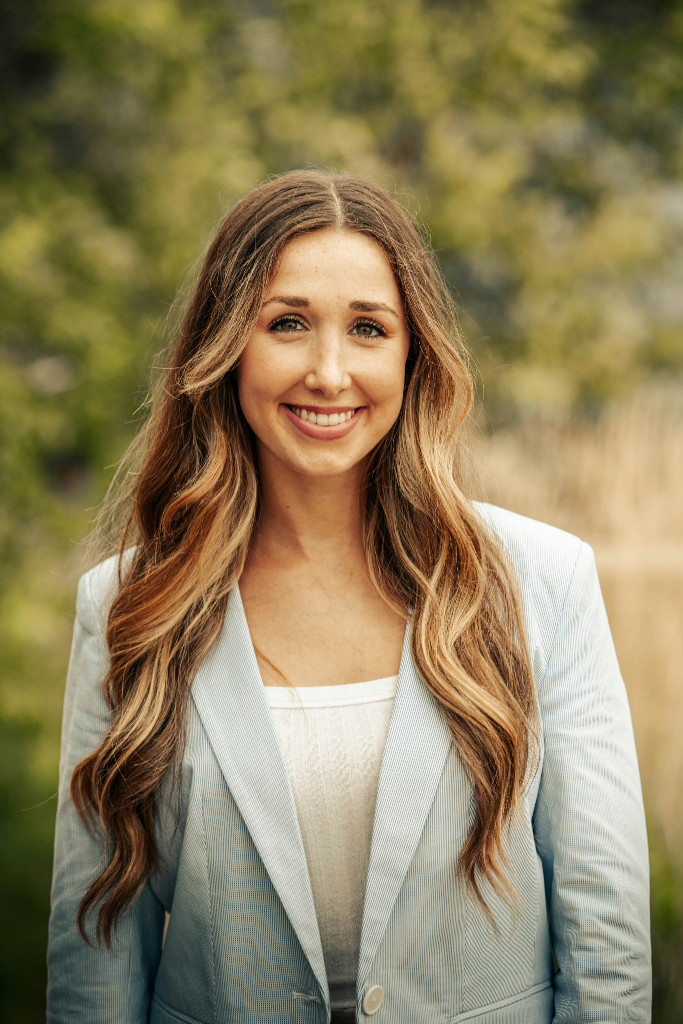 Professional headshot with background